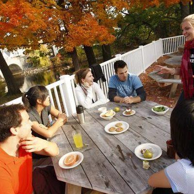 Students on the patios of Gilmore Dining Hall in Henniker